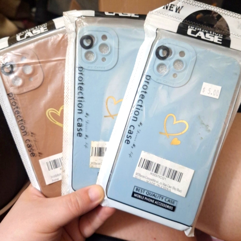 5 iphone 11 pro max brown, white,  purple, and 2 blue heart phone cases